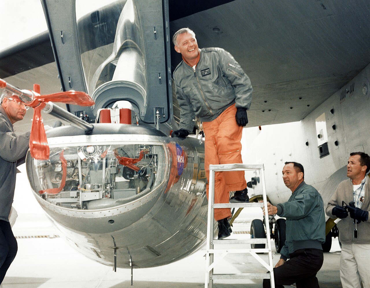 Pilot Milt Thompson standing with the M2-F2